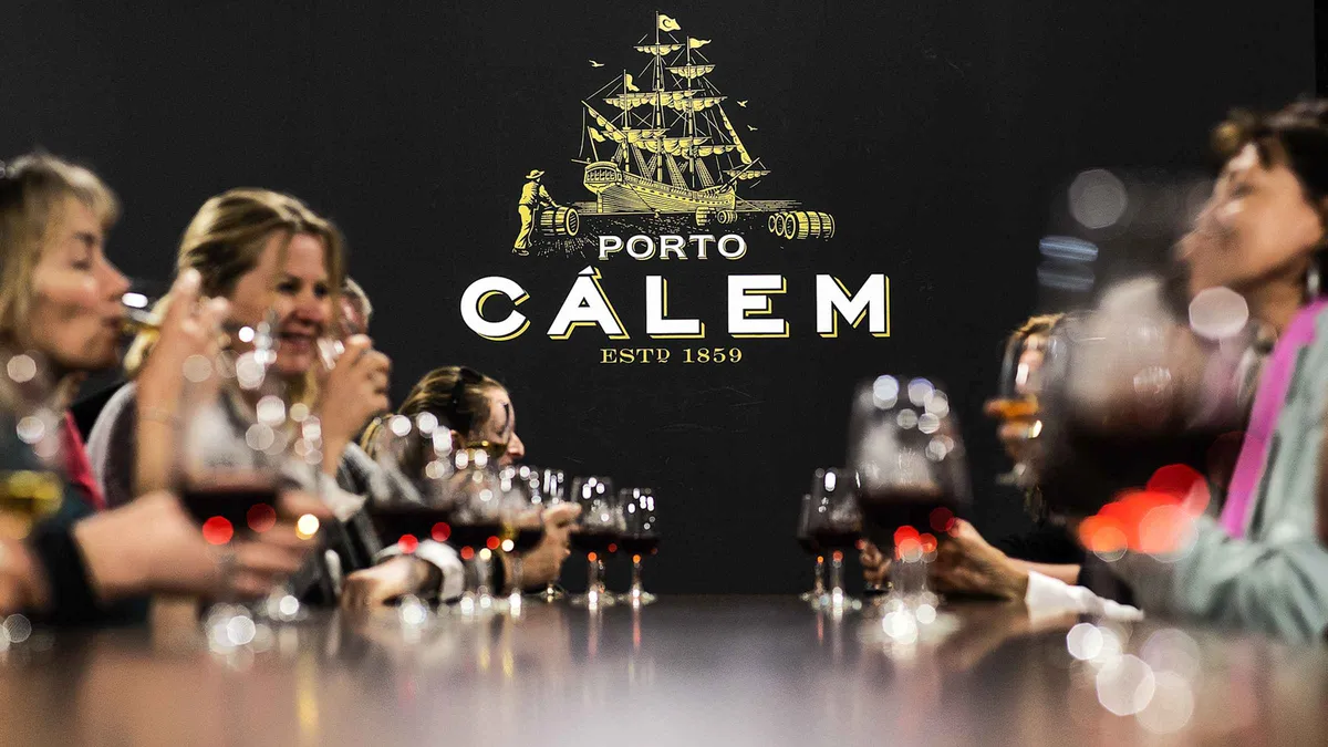 Cálem cellar barrels and interactive museum on a port wine cellar tour in Vila Nova de Gaia, Portugal