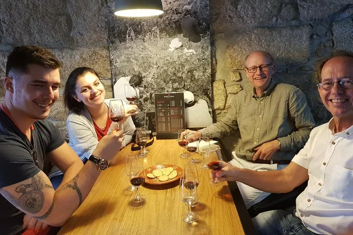 Wine lodge barrels in Vila Nova de Gaia on a small-group port and Douro wine tasting tour near Porto, Portugal