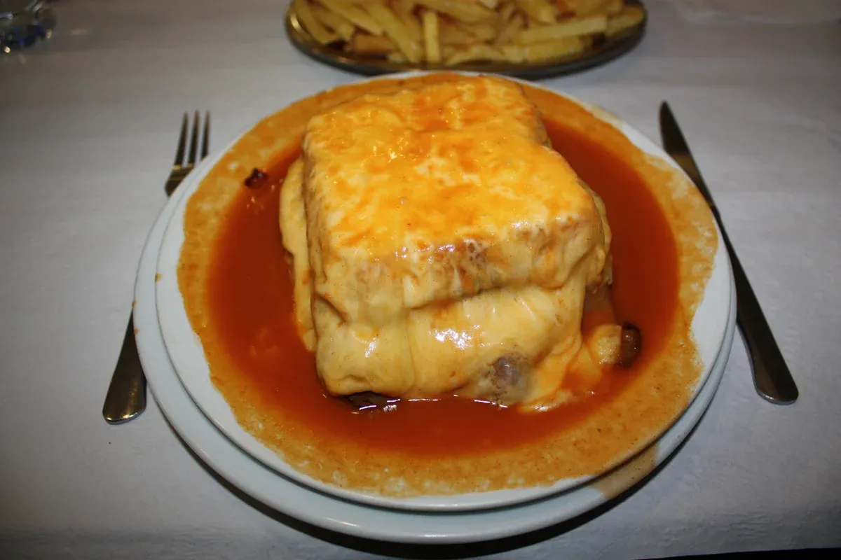 Francesinha served with fries, a Porto dish on a Porto food and wine tour