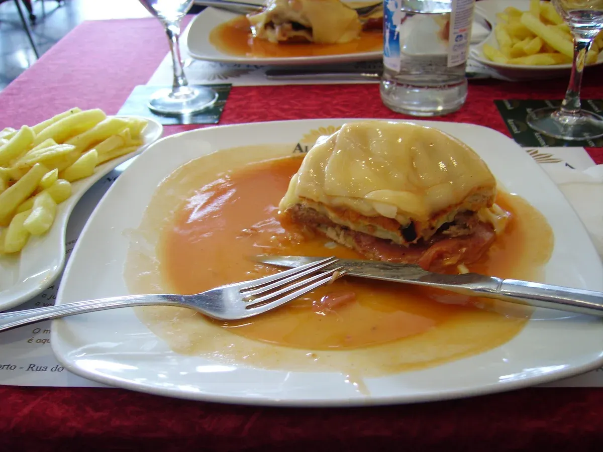 Plate of francesinha, a must-try on a Porto food tour