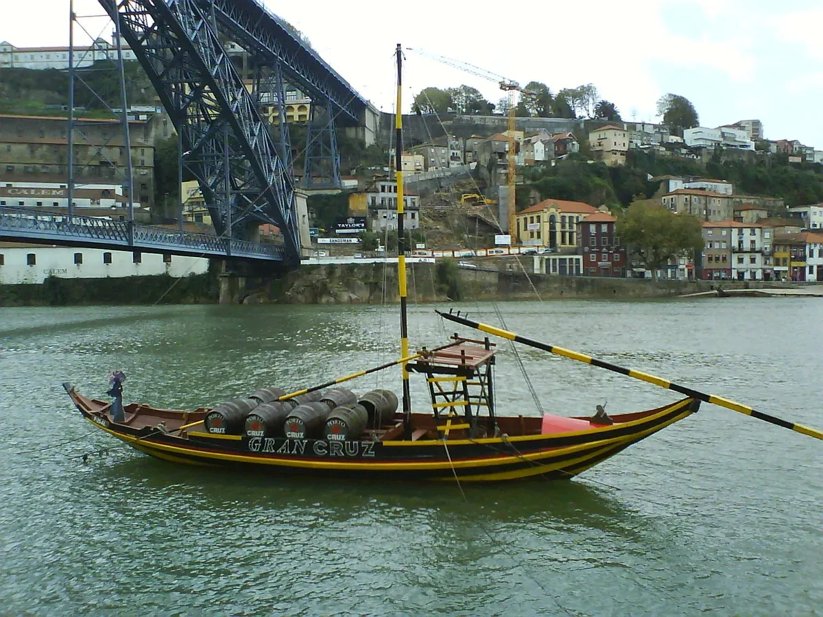 Traditional rabelo boat with port barrels on the Douro, seen on a Porto boat tour